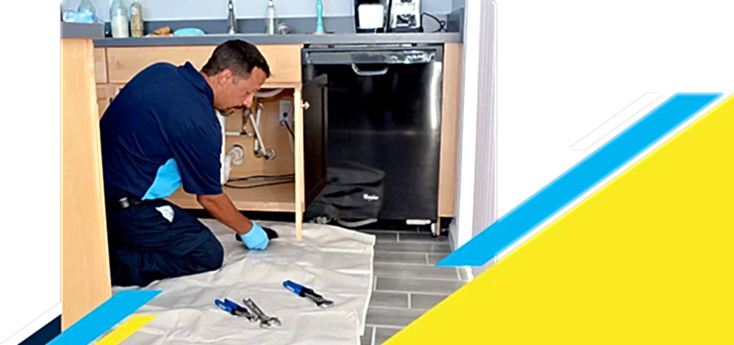 Z Plumberz technician laying out tools on floor