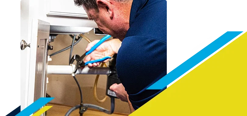 Z PLUMBERZ of East Valley technician fixing pipe under a sink