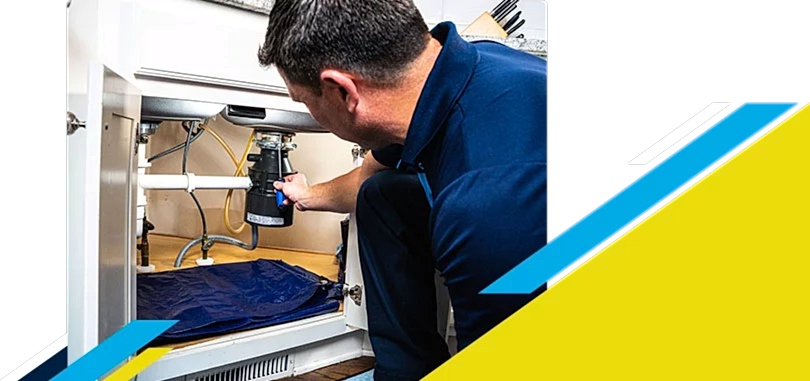Z PLUMBERZ of East Valley technician fixing garbage disposal