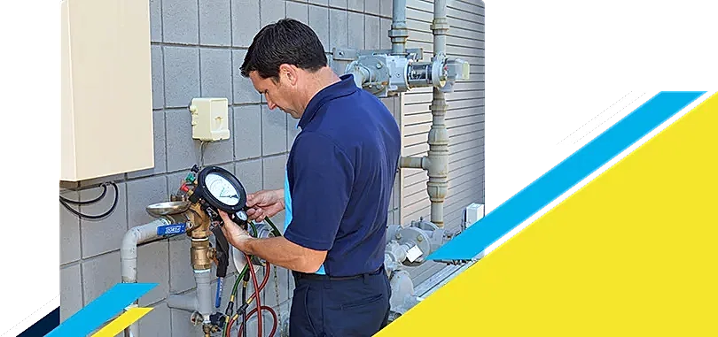 Z PLUMBERZ of Atlanta technician using a tool to measure backflow