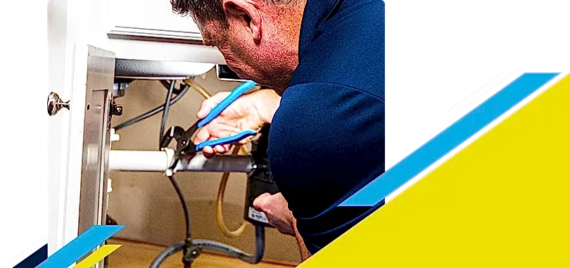 Z PLUMBERZ of Atlanta technician fixing pipe under a sink