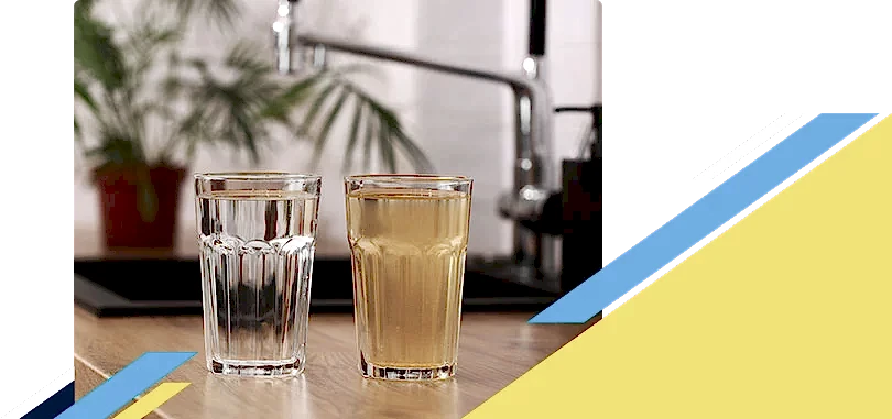 Two glasses full of water with one being clean and other dirty