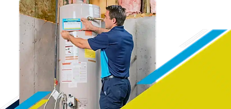 Z PLUMBERZ of Atlanta technician placing label on a water heater